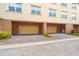 Attached garage with ample parking space, overhead lighting, and well-maintained landscaping at 10144 Arbor Run Dr # 139, Tampa, FL 33647