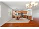 Well-lit kitchen featuring a central island, granite countertops and stainless steel appliances at 10144 Arbor Run Dr # 139, Tampa, FL 33647