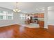 Open kitchen with wood cabinets, stainless steel appliances, and a breakfast bar area at 10144 Arbor Run Dr # 139, Tampa, FL 33647
