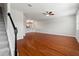 Spacious living room featuring hardwood floors, recessed lighting, and staircase access at 10144 Arbor Run Dr # 139, Tampa, FL 33647