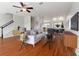 Open-concept living room featuring hardwood floors, neutral colors, and ample natural light at 10144 Arbor Run Dr # 139, Tampa, FL 33647