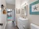 Bathroom with a sink and walk-in shower that connects to the pool at 10213 Lockwood Pines Ln, Tampa, FL 33635