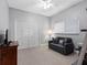 Simple bedroom featuring carpeted floors, ample storage and lots of natural light at 10213 Lockwood Pines Ln, Tampa, FL 33635