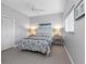 This cozy bedroom has natural light, closet and calming decor at 10213 Lockwood Pines Ln, Tampa, FL 33635
