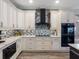 Updated kitchen with stainless steel appliances and stone backsplash at 10213 Lockwood Pines Ln, Tampa, FL 33635