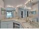 Bathroom with double sinks, granite countertops, and a large mirror at 1040 Summer Breeze Dr, Brandon, FL 33511