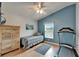This bedroom has a wood floor and a treadmill for exercising in the comfort of your own home at 1040 Summer Breeze Dr, Brandon, FL 33511
