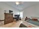 Comfortable bedroom featuring wood floors and an exterior window at 1040 Summer Breeze Dr, Brandon, FL 33511