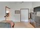Bedroom featuring wood floors with access to another room at 1040 Summer Breeze Dr, Brandon, FL 33511