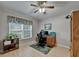 Comfortable bedroom featuring wood floors and an exterior window at 1040 Summer Breeze Dr, Brandon, FL 33511