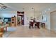 Dining area featuring a chandelier, wood floors, and an open floor plan to the kitchen at 1040 Summer Breeze Dr, Brandon, FL 33511