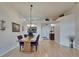 Light-filled dining room featuring a chandelier, wood floors, and seating for four at 1040 Summer Breeze Dr, Brandon, FL 33511