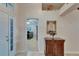 Welcoming foyer featuring a decorative mirror and beautiful entryway with neutral colors at 1040 Summer Breeze Dr, Brandon, FL 33511