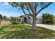 Well-maintained home with a lush front yard, mature shade tree, and a welcoming driveway at 1040 Summer Breeze Dr, Brandon, FL 33511