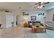 Comfortable living room with a leather sofa, plush recliner, and a decorative rug over hardwood floors at 1040 Summer Breeze Dr, Brandon, FL 33511