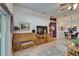 Bright living room with a piano, entertainment center, and sliding glass doors to the lanai at 1040 Summer Breeze Dr, Brandon, FL 33511