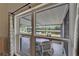 The enclosed porch offers a serene outdoor view of the beautiful, clear water at 1040 Summer Breeze Dr, Brandon, FL 33511