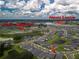 Aerial view of the community showcasing the location of the lagoon and the clubhouse at 10446 Tupper Cay Dr, San Antonio, FL 33576