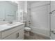 Bathroom with a combined tub and shower and white subway tiles at 10446 Tupper Cay Dr, San Antonio, FL 33576