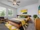 Stylish bedroom with modern decor, featuring a neutral color scheme and natural light at 10446 Tupper Cay Dr, San Antonio, FL 33576