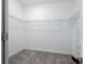 Walk-in closet with wire shelving and carpet at 10446 Tupper Cay Dr, San Antonio, FL 33576