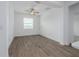 Dining area with wood-look tile flooring, ceiling fan, and natural light at 10446 Tupper Cay Dr, San Antonio, FL 33576