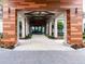 Stunning entrance featuring wood and stone columns and a beautiful stone-paved walkway at 10446 Tupper Cay Dr, San Antonio, FL 33576