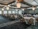Spacious event space featuring elegant chandeliers, tables with seating, and ample room for gatherings at 10446 Tupper Cay Dr, San Antonio, FL 33576