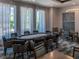 Upscale game room featuring a poker table, chairs, and stylish decor for an enjoyable gaming experience at 10446 Tupper Cay Dr, San Antonio, FL 33576