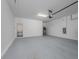 Spacious garage with epoxy floor and water heater at 10446 Tupper Cay Dr, San Antonio, FL 33576