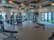 A bright fitness center featuring weight machines, treadmills, and stationary bikes for resident workouts at 10446 Tupper Cay Dr, San Antonio, FL 33576