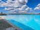 Expansive lagoon view showcasing crystal-clear turquoise waters, offering a resort-style experience, under a brilliant blue sky at 10446 Tupper Cay Dr, San Antonio, FL 33576
