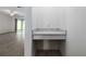 Open-concept living room featuring a built-in desk area with modern countertops at 10446 Tupper Cay Dr, San Antonio, FL 33576
