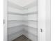 Walk-in pantry with wire shelving, offering plenty of storage space at 10446 Tupper Cay Dr, San Antonio, FL 33576