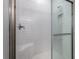 Modern shower with white subway tile and a glass door at 10446 Tupper Cay Dr, San Antonio, FL 33576