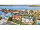 Aerial view of a waterfront property with a private pool and a convenient location near the bay at 1058 Eldorado Ave, Clearwater Beach, FL 33767