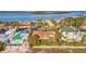 A high angle view of nice houses with grassy yards near a beach and ocean at 1058 Eldorado Ave, Clearwater Beach, FL 33767