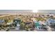 This high angle aerial view features houses on a beach near a beautiful blue ocean at 1058 Eldorado Ave, Clearwater Beach, FL 33767