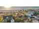 Stunning aerial view of luxurious homes near the beach with beautiful landscaping and ocean views at 1058 Eldorado Ave, Clearwater Beach, FL 33767
