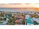 Luxurious waterfront property offering breathtaking views, lush landscaping, and a private beach at 1058 Eldorado Ave, Clearwater Beach, FL 33767