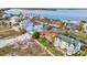 A high angle view of houses with swimming pools close to a beach and waterway at 1058 Eldorado Ave, Clearwater Beach, FL 33767