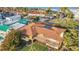 Aerial view of coastal home with an in-deck pool near bay area and nearby businesses and restaurants at 1058 Eldorado Ave, Clearwater Beach, FL 33767