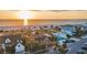 Breathtaking aerial view of beachside homes with lush greenery and ocean sunsets at 1058 Eldorado Ave, Clearwater Beach, FL 33767