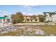 Spacious backyard with mature trees and outdoor living spaces, perfect for entertaining or relaxation at 1058 Eldorado Ave, Clearwater Beach, FL 33767