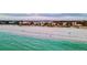 Picturesque beach view at sunset with crystal clear ocean waters and a soft sandy shoreline at 1058 Eldorado Ave, Clearwater Beach, FL 33767