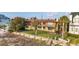 This home features a grassy yard, privacy wall, and is close to the beach at 1058 Eldorado Ave, Clearwater Beach, FL 33767