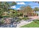 Beautiful two-story home with a brick driveway and lush landscaping under a sunny blue sky at 1058 Eldorado Ave, Clearwater Beach, FL 33767