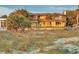 A two-story beachfront home with a balcony and a lush lawn at 1058 Eldorado Ave, Clearwater Beach, FL 33767