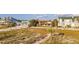 Lovely beach houses sit beside sandy dunes under a blue sky with fluffy clouds at 1058 Eldorado Ave, Clearwater Beach, FL 33767