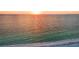 Aerial view of turquoise ocean waves during sunset, reflecting sky at 1058 Eldorado Ave, Clearwater Beach, FL 33767